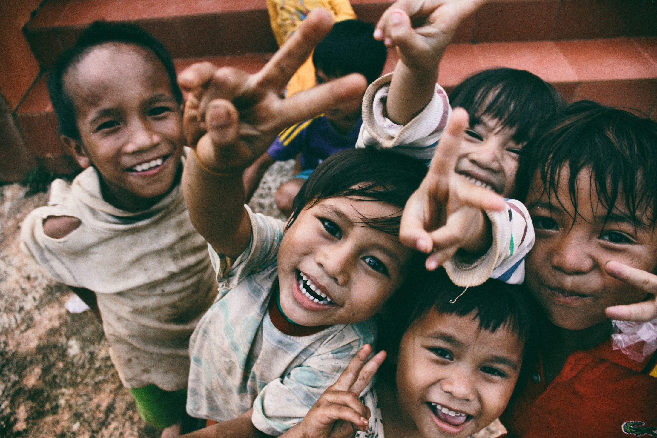 Children smiling together during a community programme
